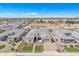 Aerial view of the home highlighting the lush front yard, desert landscaping and paver driveway at 3466 E Hazeltine Way, Queen Creek, AZ 85142