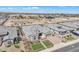 An aerial shot of the home shows the lush front yard, desert landscaping and wide driveway at 3466 E Hazeltine Way, Queen Creek, AZ 85142
