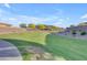 Expansive community greenway with desert landscaping and privacy wall at 3466 E Hazeltine Way, Queen Creek, AZ 85142