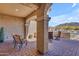 Covered patio with comfortable seating, offering a relaxing outdoor living space at 3466 E Hazeltine Way, Queen Creek, AZ 85142