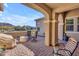 Inviting covered patio with seating, providing a comfortable outdoor living area with scenic views at 3466 E Hazeltine Way, Queen Creek, AZ 85142