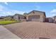 Beautiful home with paved driveway, manicured lawn and desert landscaping in a suburban setting at 3466 E Hazeltine Way, Queen Creek, AZ 85142