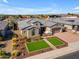 Beautiful single-story home featuring desert landscaping and a paver driveway leading to a two-car garage at 3466 E Hazeltine Way, Queen Creek, AZ 85142