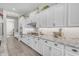 Gourmet kitchen boasts granite countertops, custom cabinets, and premium stainless steel appliances at 3466 E Hazeltine Way, Queen Creek, AZ 85142