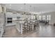 Spacious open kitchen with a large island, breakfast bar, and adjacent dining area at 3466 E Hazeltine Way, Queen Creek, AZ 85142