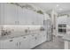 Bright kitchen with white cabinets, stainless steel appliances, and elegant granite countertops at 3466 E Hazeltine Way, Queen Creek, AZ 85142