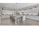 Expansive kitchen with oversized island, stylish stools, and custom white cabinetry at 3466 E Hazeltine Way, Queen Creek, AZ 85142