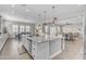 Open-concept kitchen with a large island, granite countertops, and stainless-steel appliances at 3466 E Hazeltine Way, Queen Creek, AZ 85142