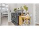 Functional laundry room with modern appliances, wood look tile floors, and stylish decor at 3466 E Hazeltine Way, Queen Creek, AZ 85142