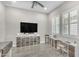 Open living room featuring plantation shutters, recessed lighting, and wood-look tile flooring at 3466 E Hazeltine Way, Queen Creek, AZ 85142