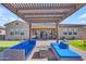 Covered patio featuring comfortable outdoor seating, perfect for relaxation and entertaining at 3466 E Hazeltine Way, Queen Creek, AZ 85142