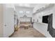 Spacious walk-in closet with built-in shelving, wood look tile floors, and two windows for natural light at 3466 E Hazeltine Way, Queen Creek, AZ 85142