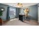 A simple bedroom featuring a window and a small table with two chairs at 4046 E Laurel Ave, Gilbert, AZ 85234