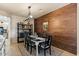Bright dining area boasts a decorative wood accent wall, complemented by stylish decor and modern lighting fixtures at 4046 E Laurel Ave, Gilbert, AZ 85234