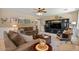 Comfortable living room with plush sofas, stylish decor, and a large entertainment center for relaxing evenings at 4046 E Laurel Ave, Gilbert, AZ 85234