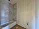 Partially finished bathroom with tiled shower and floor, offering a contemporary design at 4160 N Tamarax Dr, Eloy, AZ 85131