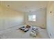 Bedroom with light walls, concrete floor, and natural light, creating a comfortable atmosphere at 4160 N Tamarax Dr, Eloy, AZ 85131