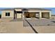 Home exterior featuring a spacious three-car garage and a charming paver driveway, offering curb appeal at 4160 N Tamarax Dr, Eloy, AZ 85131