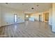 Spacious living room with tile flooring and natural light from the glass door, perfect for entertaining at 4160 N Tamarax Dr, Eloy, AZ 85131