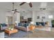 Open-concept living room with modern furnishings and decor, adjacent to a dining area and kitchen at 4968 E Westchester Dr, Chandler, AZ 85249