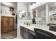 Modern bathroom featuring a large vanity mirror, walk-in shower, and a closet at 11822 W Softwind Dr, Sun City, AZ 85373