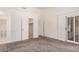 Spacious bedroom with walk-in closet and attached bathroom featuring updated fixtures at 15460 W Amelia Dr, Goodyear, AZ 85395