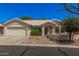 Charming single-story home featuring low-maintenance landscaping and an attached two-car garage at 15460 W Amelia Dr, Goodyear, AZ 85395