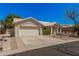 Inviting one-story home with a tile roof, two-car garage, and desert-style front yard at 15460 W Amelia Dr, Goodyear, AZ 85395