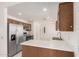 Well-equipped kitchen with stainless steel appliances, plentiful cabinet space, and a bright atmosphere at 15460 W Amelia Dr, Goodyear, AZ 85395