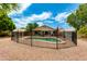 Fenced backyard oasis with a pool, mature landscaping, and gravel ground cover at 16642 N 35Th Way, Phoenix, AZ 85032