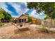 Backyard featuring a hammock, gravel ground cover, and outdoor dining area at 16642 N 35Th Way, Phoenix, AZ 85032