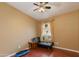 Neutral bedroom with hardwood floors, ceiling fan, and a window with curtains at 16642 N 35Th Way, Phoenix, AZ 85032