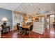Dining area adjacent to the kitchen, showcasing hardwood floors and natural lighting at 16642 N 35Th Way, Phoenix, AZ 85032