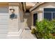 Inviting front entryway with security screen door, textured walls, and a decorative address number at 16642 N 35Th Way, Phoenix, AZ 85032