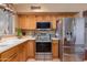 Functional kitchen with stainless steel appliances, tile flooring, and ample counter space at 16642 N 35Th Way, Phoenix, AZ 85032