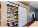 Well-stocked pantry with a sliding barn door for easy access and organization at 16642 N 35Th Way, Phoenix, AZ 85032