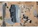 Aerial view shows a new home construction site with various building materials and equipment at 3323 N 81St St, Mesa, AZ 85207