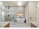 The elegant bathroom features a standalone tub, sleek faucets, and a glass-enclosed shower area at 3323 N 81St St, Mesa, AZ 85207