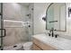 Elegant bathroom with glass enclosed shower, modern vanity with marble countertop, and neutral tones at 3323 N 81St St, Mesa, AZ 85207