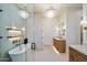 This luxurious bathroom offers dual vanities, a soaking tub, and a glass-enclosed shower with high end fixtures at 3323 N 81St St, Mesa, AZ 85207