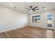This light and airy bedroom has a modern design, custom accent wall, and direct access to the backyard at 3323 N 81St St, Mesa, AZ 85207