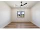 Bright bedroom with natural light boasts a pair of windows and wood floors, creating a serene atmosphere at 3323 N 81St St, Mesa, AZ 85207