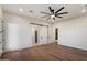 Unfurnished bedroom with ample natural light, a ceiling fan, and a closet with sliding doors at 3323 N 81St St, Mesa, AZ 85207