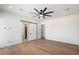 Spacious bedroom features sleek ceiling fan, and convenient access to a walk-in closet with sliding barn doors at 3323 N 81St St, Mesa, AZ 85207
