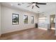 Bright and spacious bonus room featuring a bar area with floating shelves and modern light fixtures at 3323 N 81St St, Mesa, AZ 85207