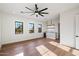 Bonus room with multiple windows, hardwood floors, recessed lighting, and a bar area at 3323 N 81St St, Mesa, AZ 85207