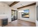 Bright dining area featuring a modern chandelier, views of the backyard, and neutral finishes at 3323 N 81St St, Mesa, AZ 85207