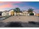 Stunning exterior with stone accents and modern design under a gorgeous sunset sky at 3323 N 81St St, Mesa, AZ 85207