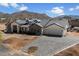 Spacious home with a brick paver driveway, three-car garage, and mountain views at 3323 N 81St St, Mesa, AZ 85207