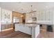 Expansive kitchen island with quartz countertops and stylish cabinetry perfect for entertaining at 3323 N 81St St, Mesa, AZ 85207